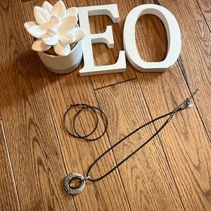 Black Hoop Earrings and Silver Necklace